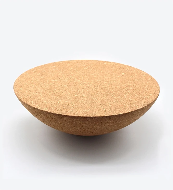 Natural cork balance half ball shown with its flat training surface facing upward
