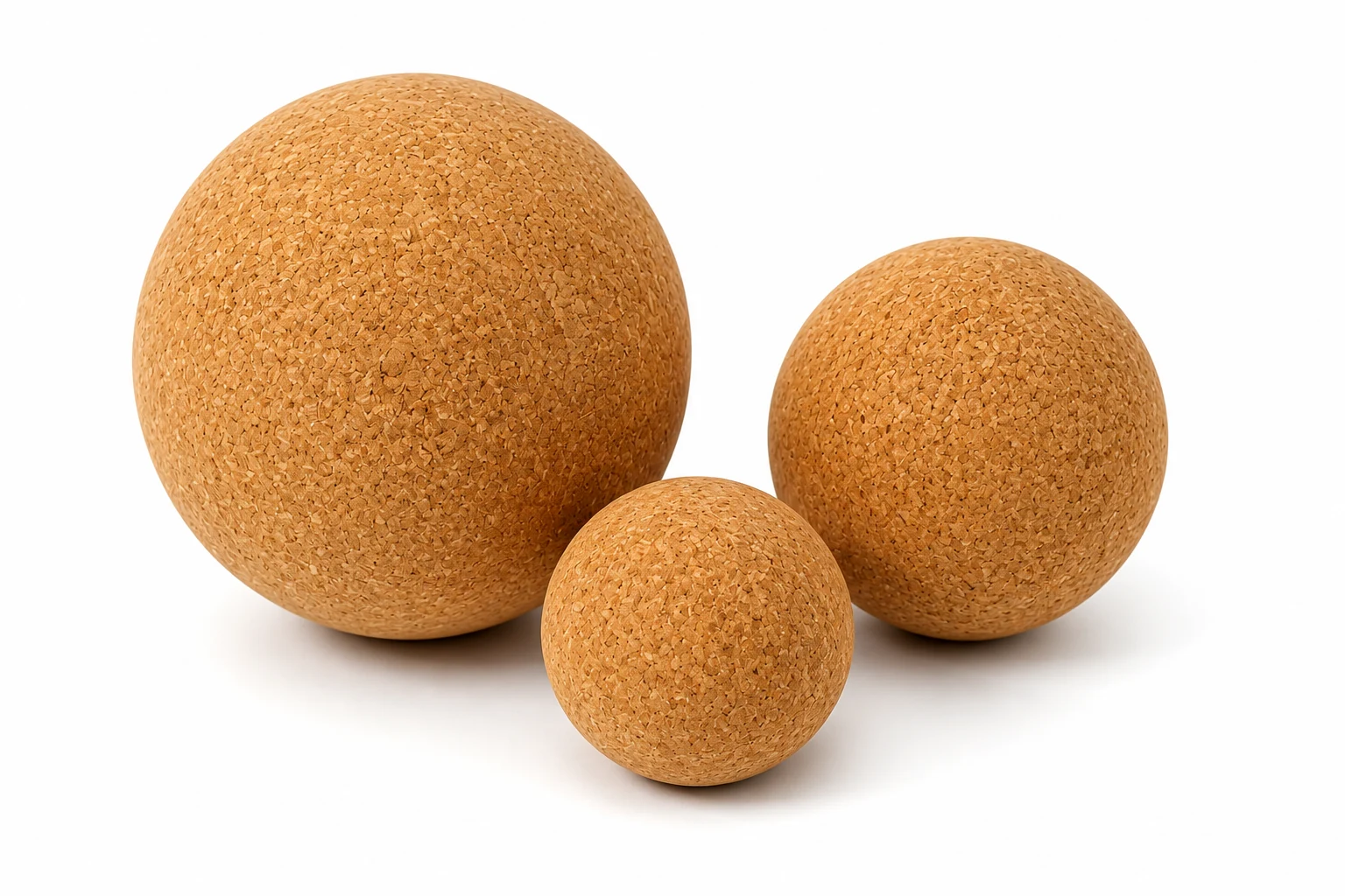 Three natural cork massage balls in different sizes